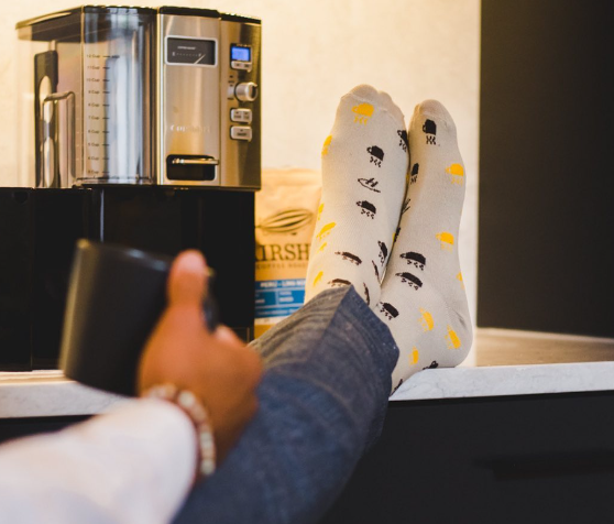 Beige over the calf dress socks with luggage prints in brown and yellow colors