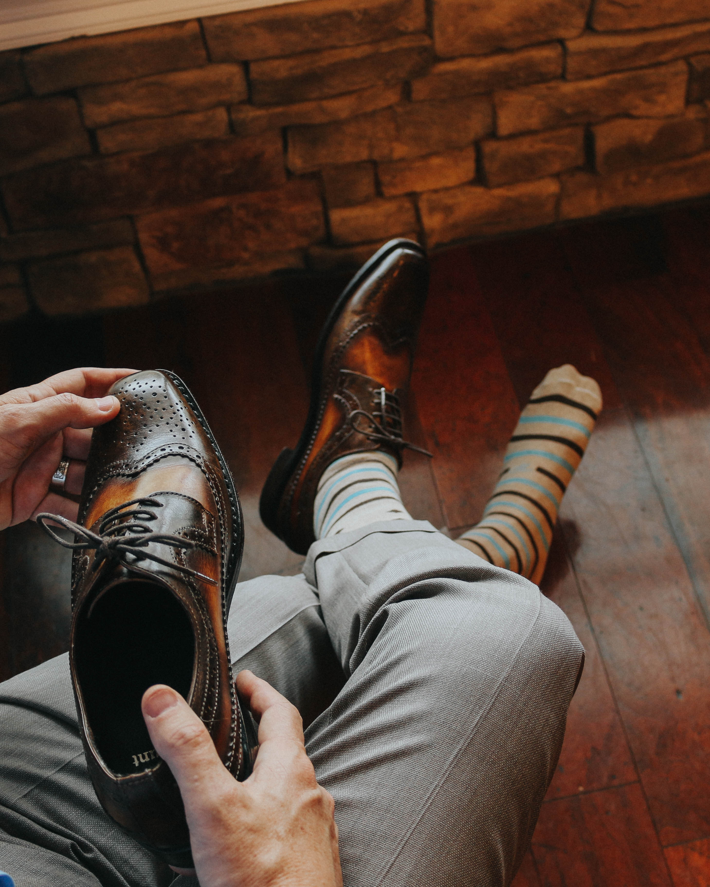 beige over the calf dress socks with light blue and brown stripes, brown dress shoes, grey dress pants