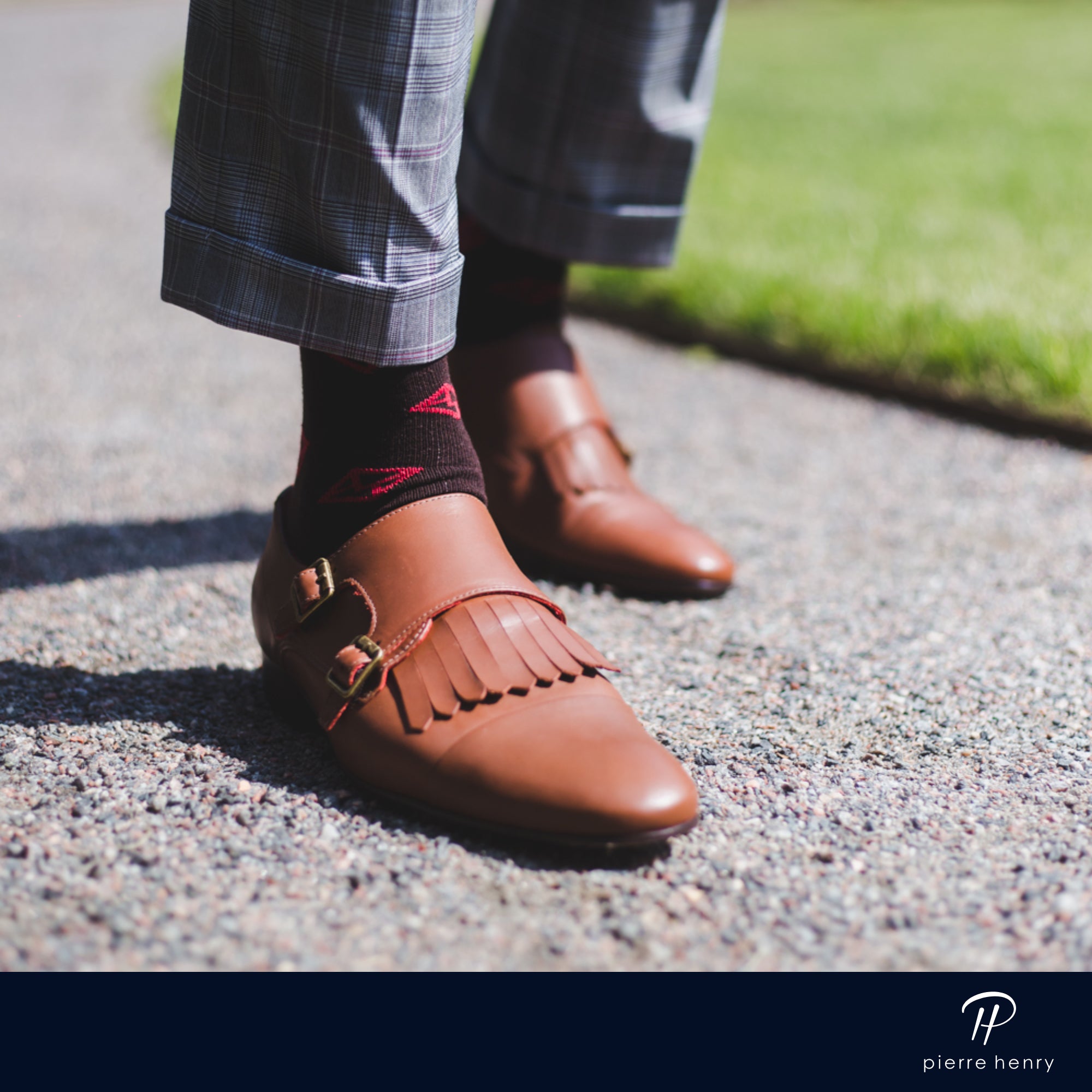 dark brown over the calf dress socks with red envelope print, grey plaid dress pants, light brown dress shoes