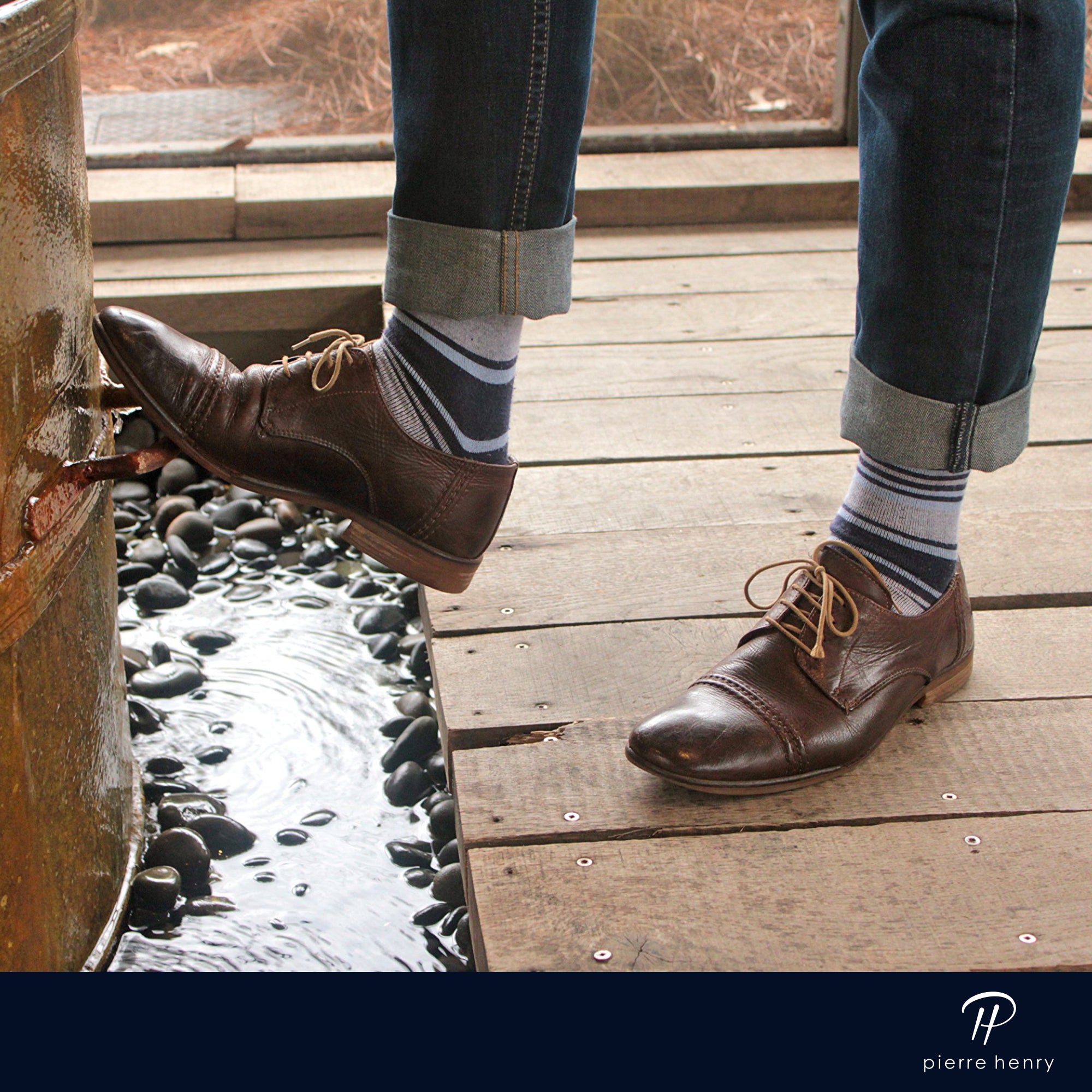 blue and grey striped over the calf dress socks, brown dress shoes, and blue jeans