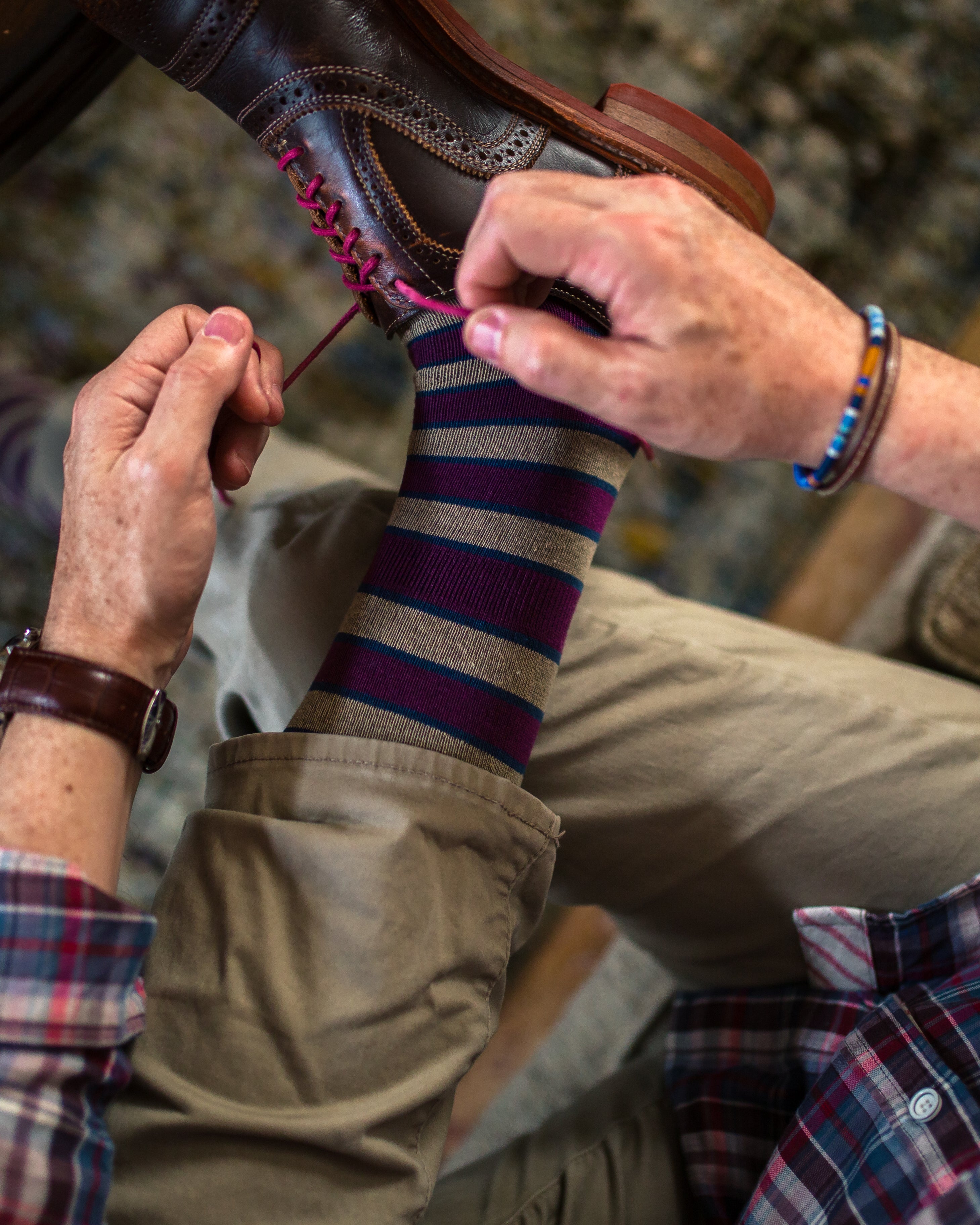 light brown and burgundy over the calf dress socks, brown dress shoes with pink laces, khaki pants