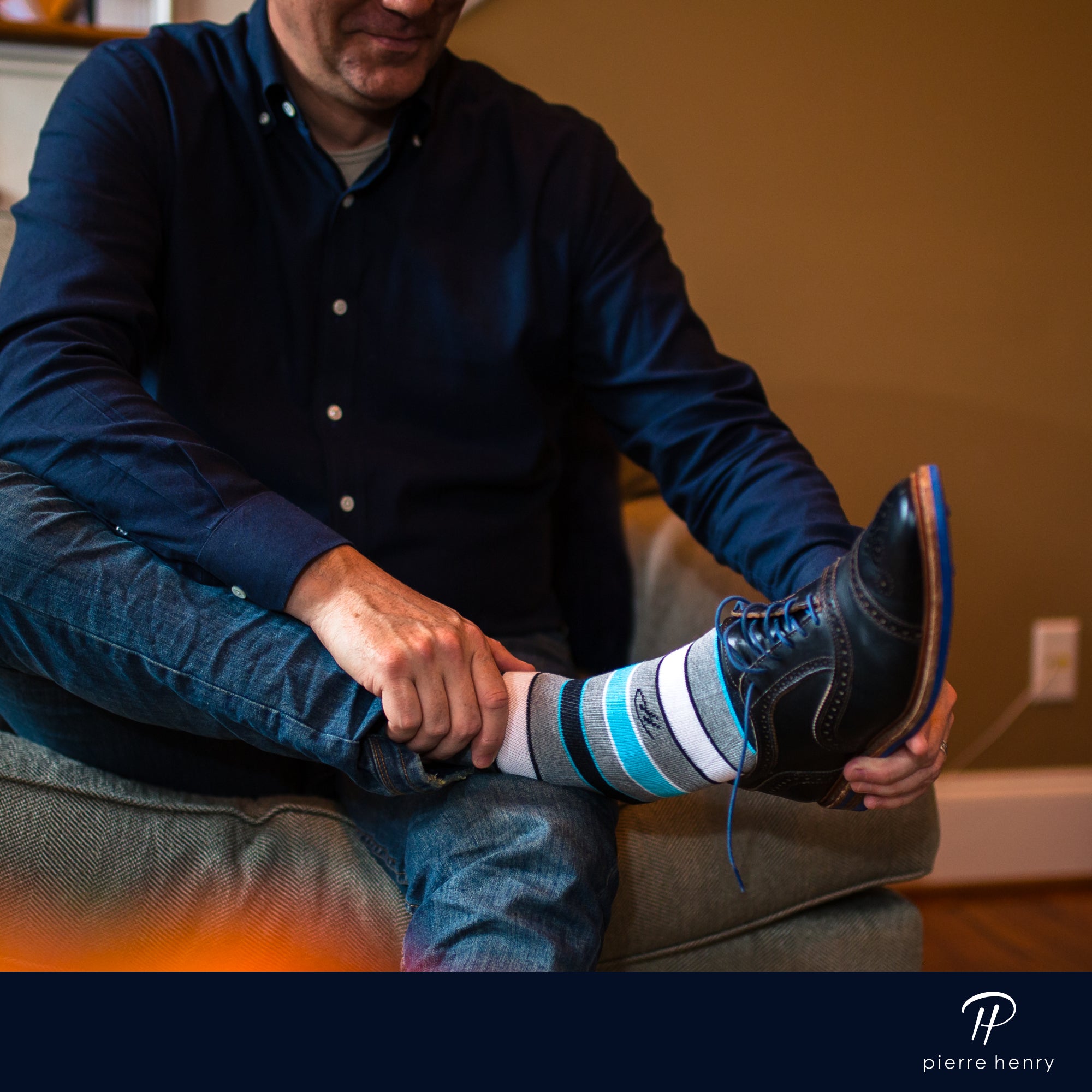 grey over the calf dress socks with white light blue and black stripes, brown dress shoes with blue laces, blue jeans