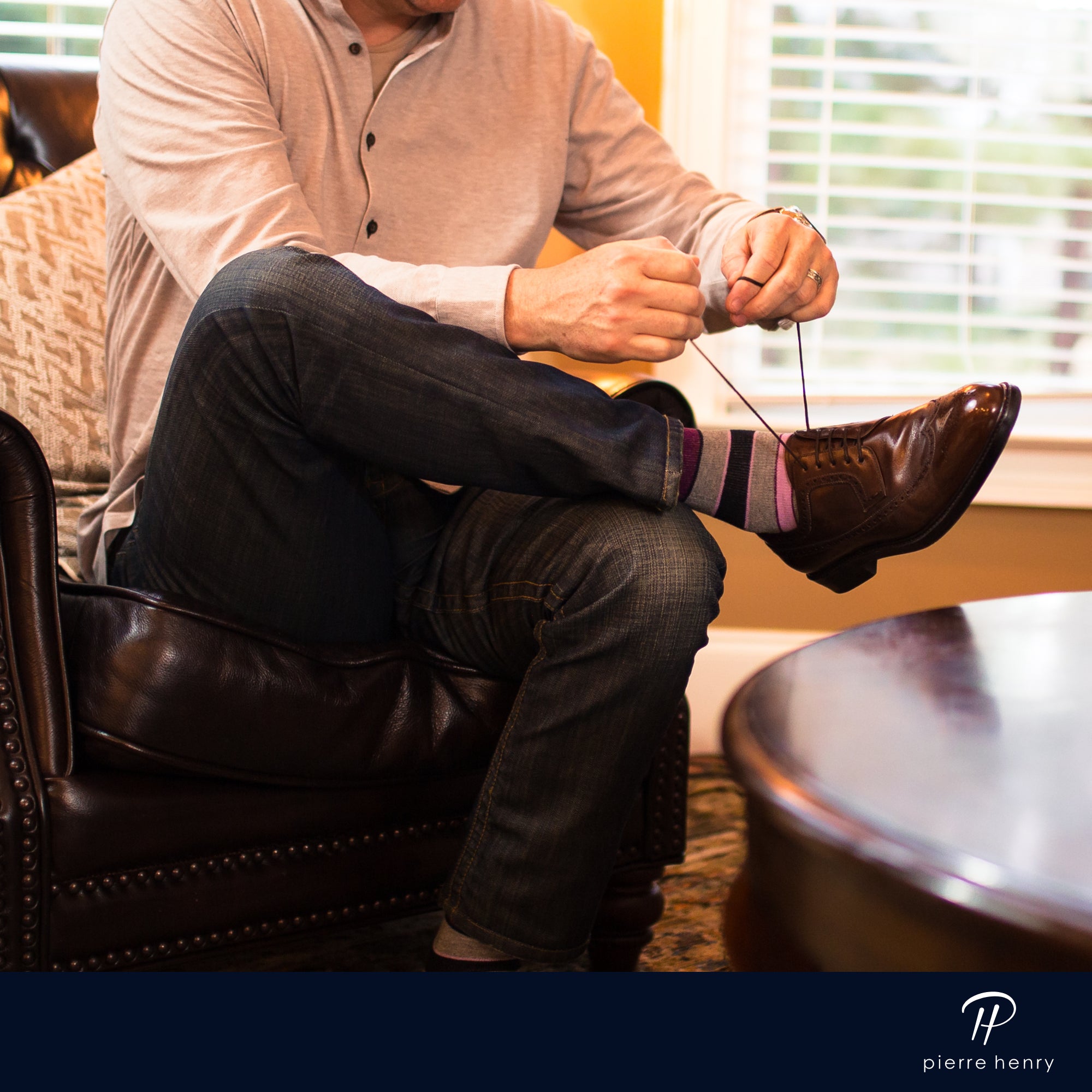 beige over the calf dress socks with pink and burgundy stripes, grey jeans, brown dress shoes