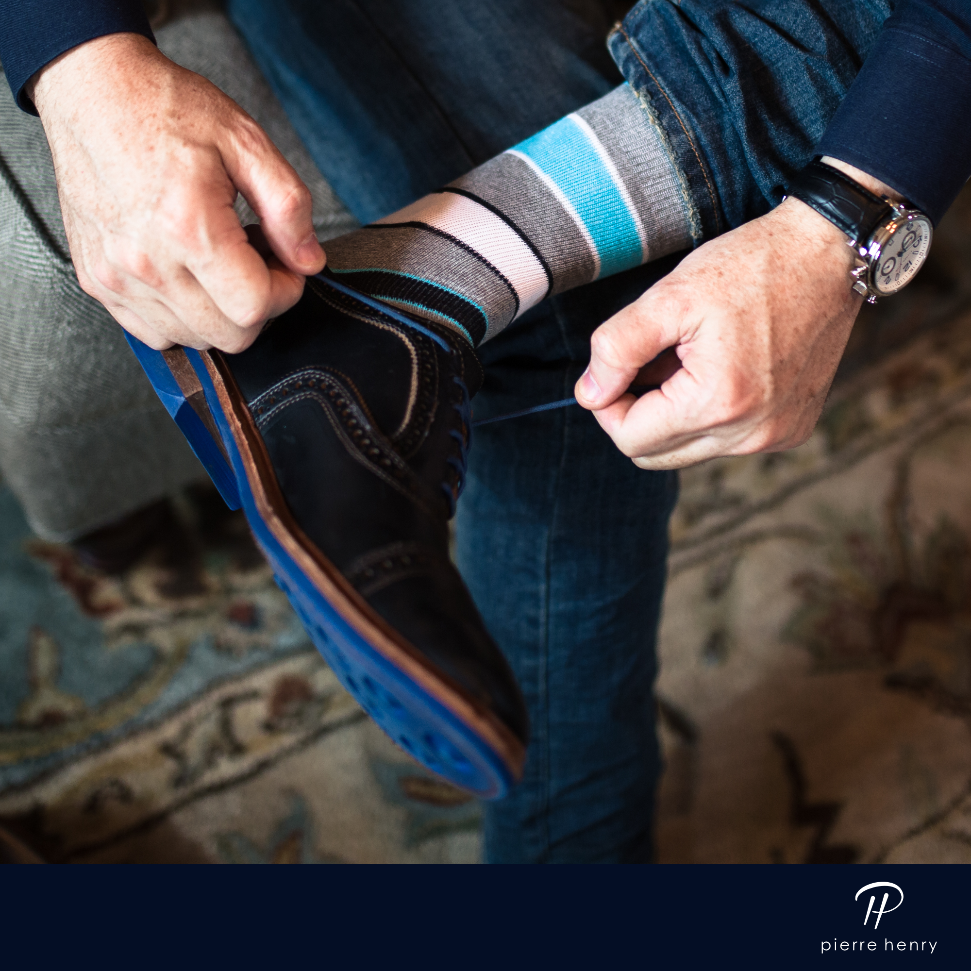 grey over the calf dress socks with light blue white and black stripes, black dress socks with blue laces, blue jeans, black watch