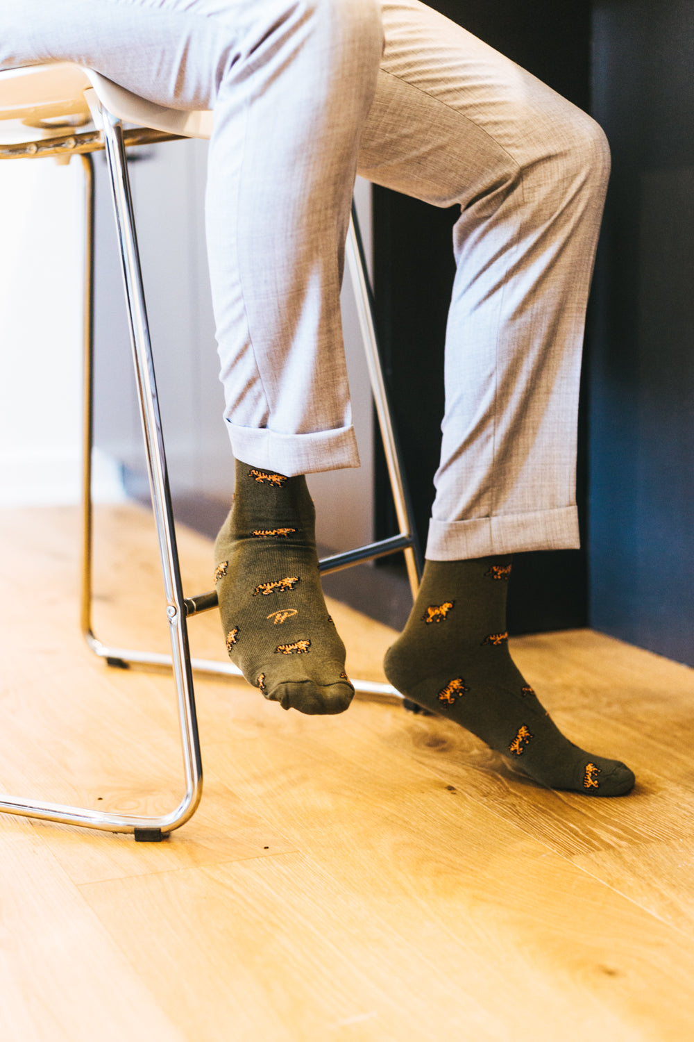camo green over the calf dress socks with tiger prints, light beige dress pants