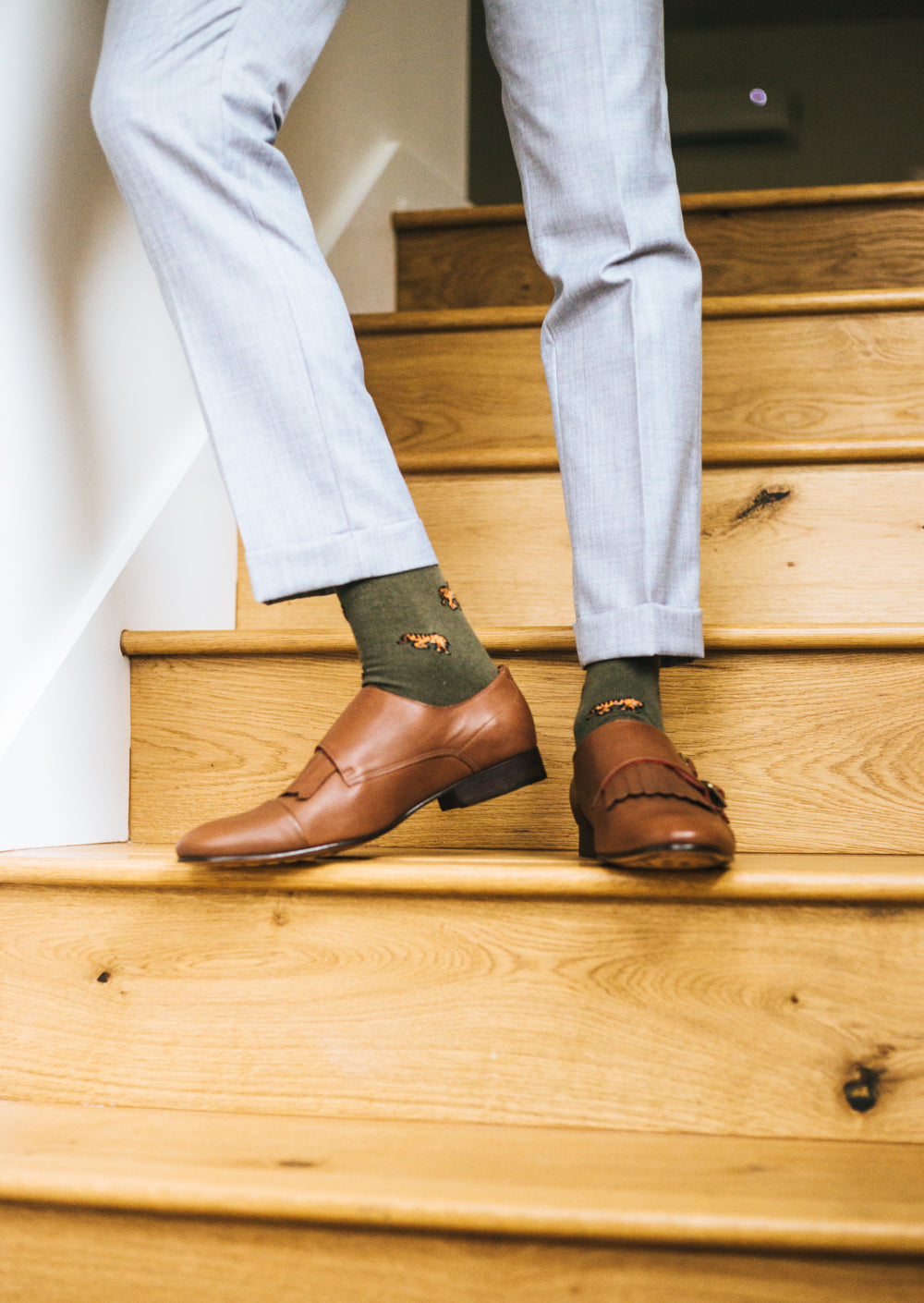 green over the calf dress socks with tiger prints, light brown dress shoes, light grey dress pants