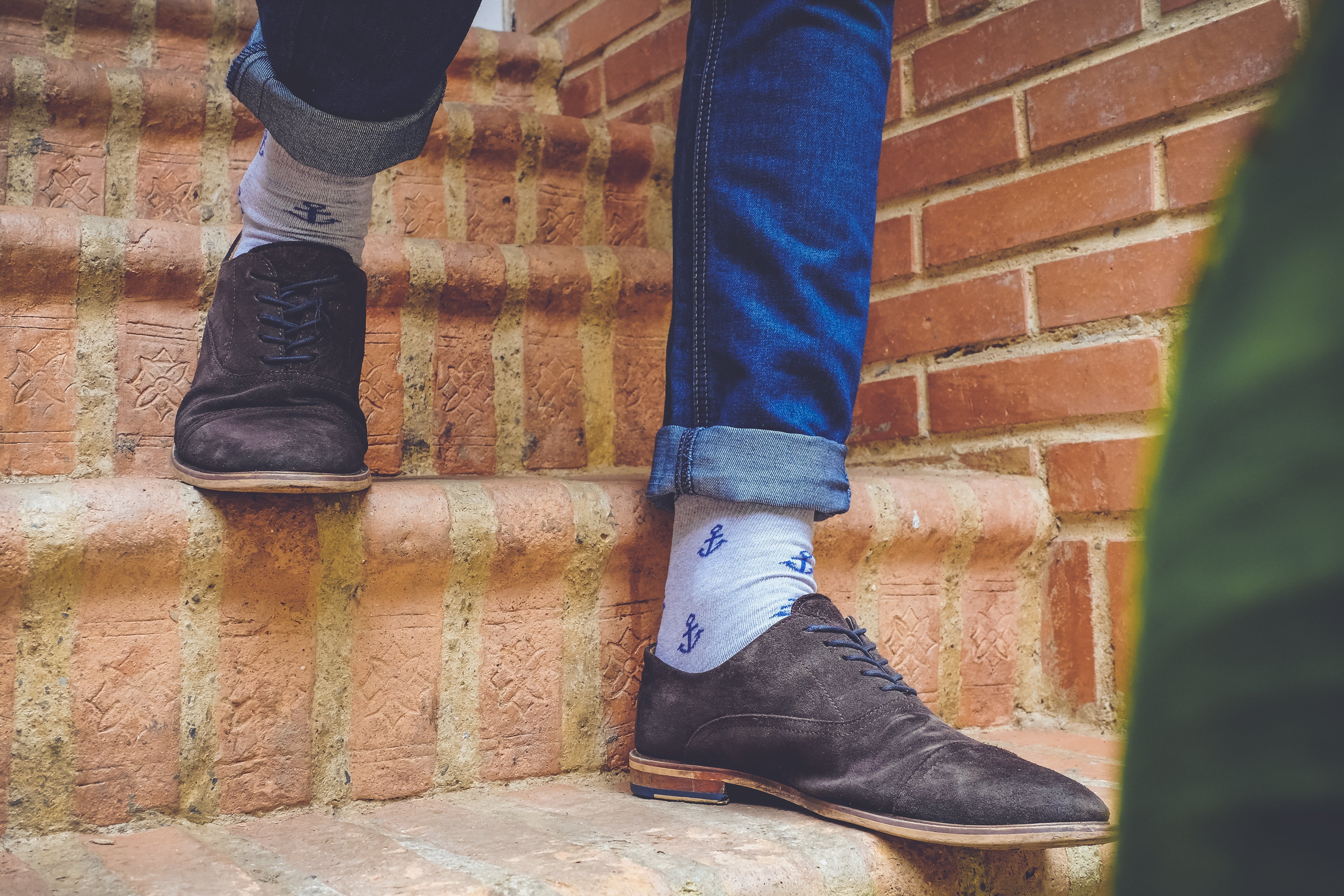 light grey over the calf dress socks with blue anchors, brown dress shoes, blue jeans