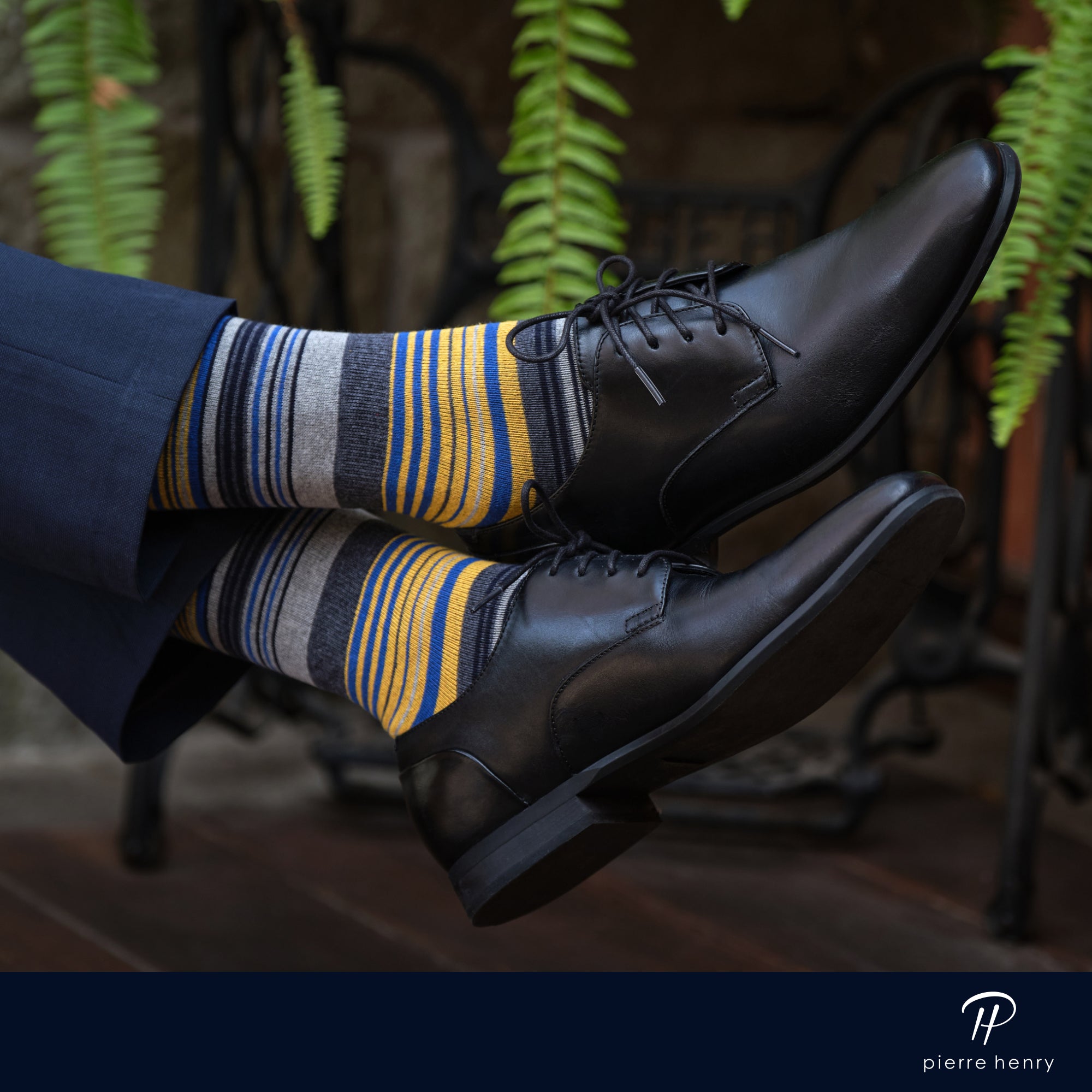 yellow blue black and light grey striped over the calf dress socks, black dress shoes, navy suit pants