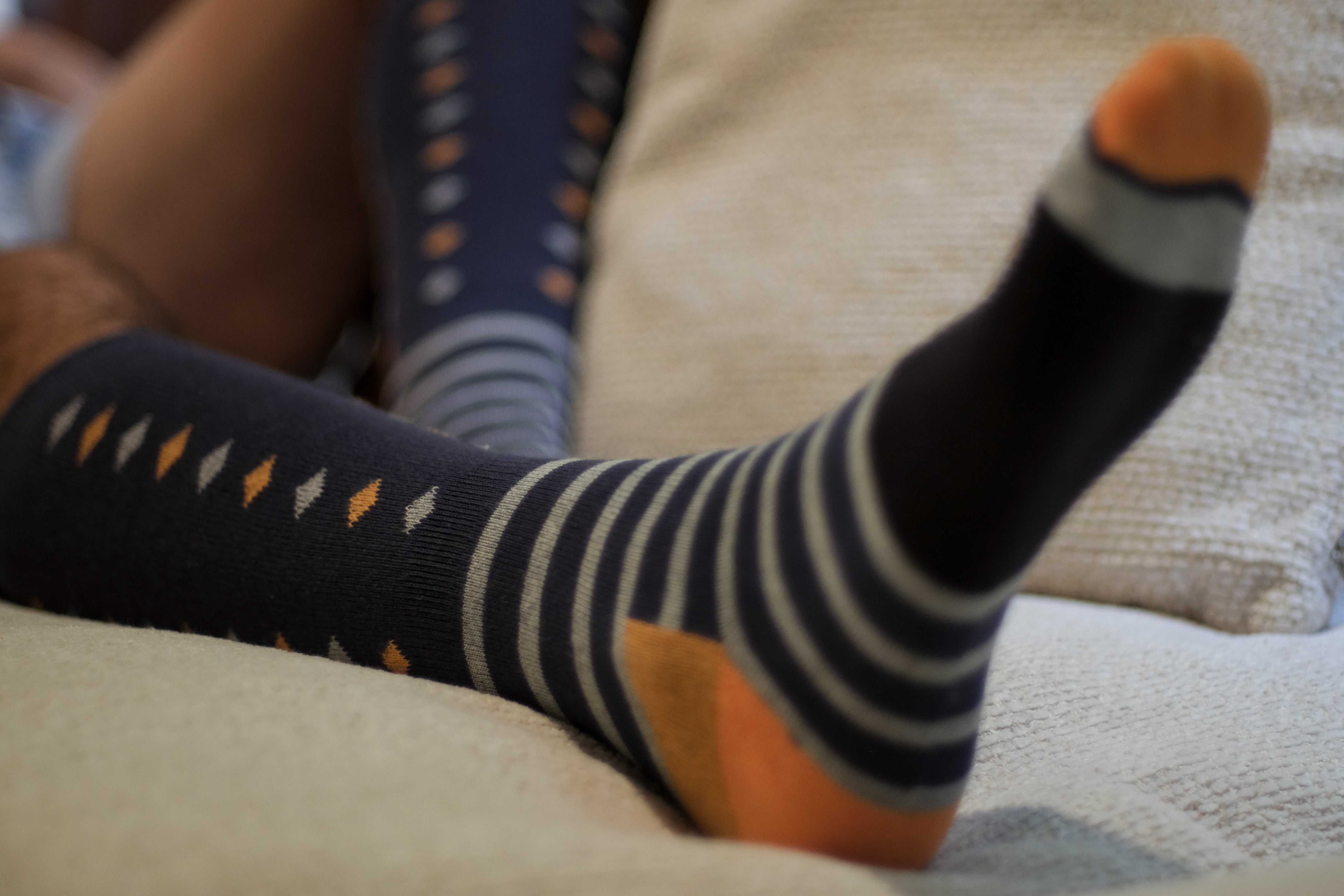 black over the calf dress socks with beige and orange diamonds beige stripes and orange toe and heel