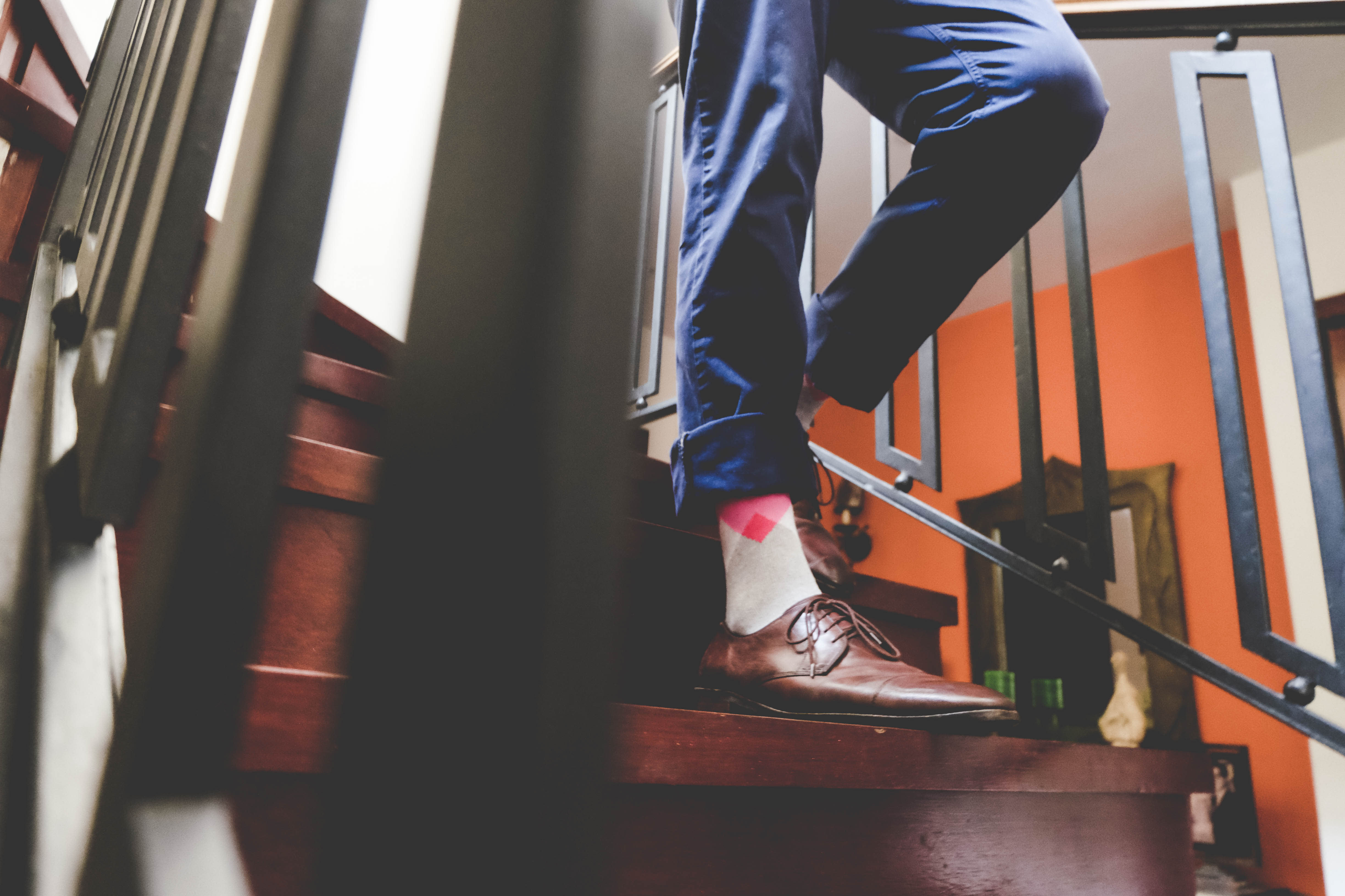 light grey over the calf dress socks with pink diamond in middle, brown dress shoes, blue jeans