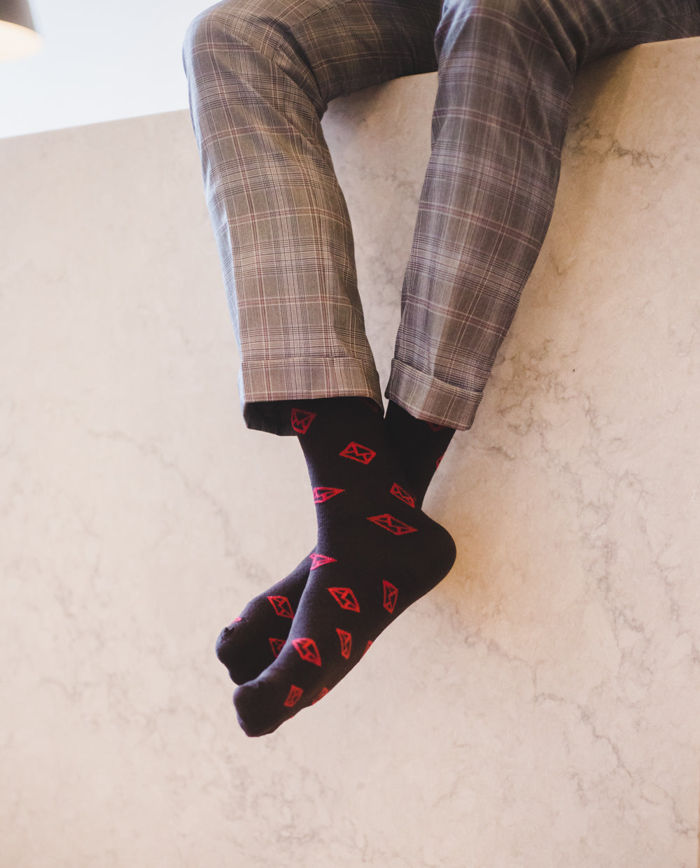 dark brown over the calf dress socks with red envelope print, grey plaid dress pants
