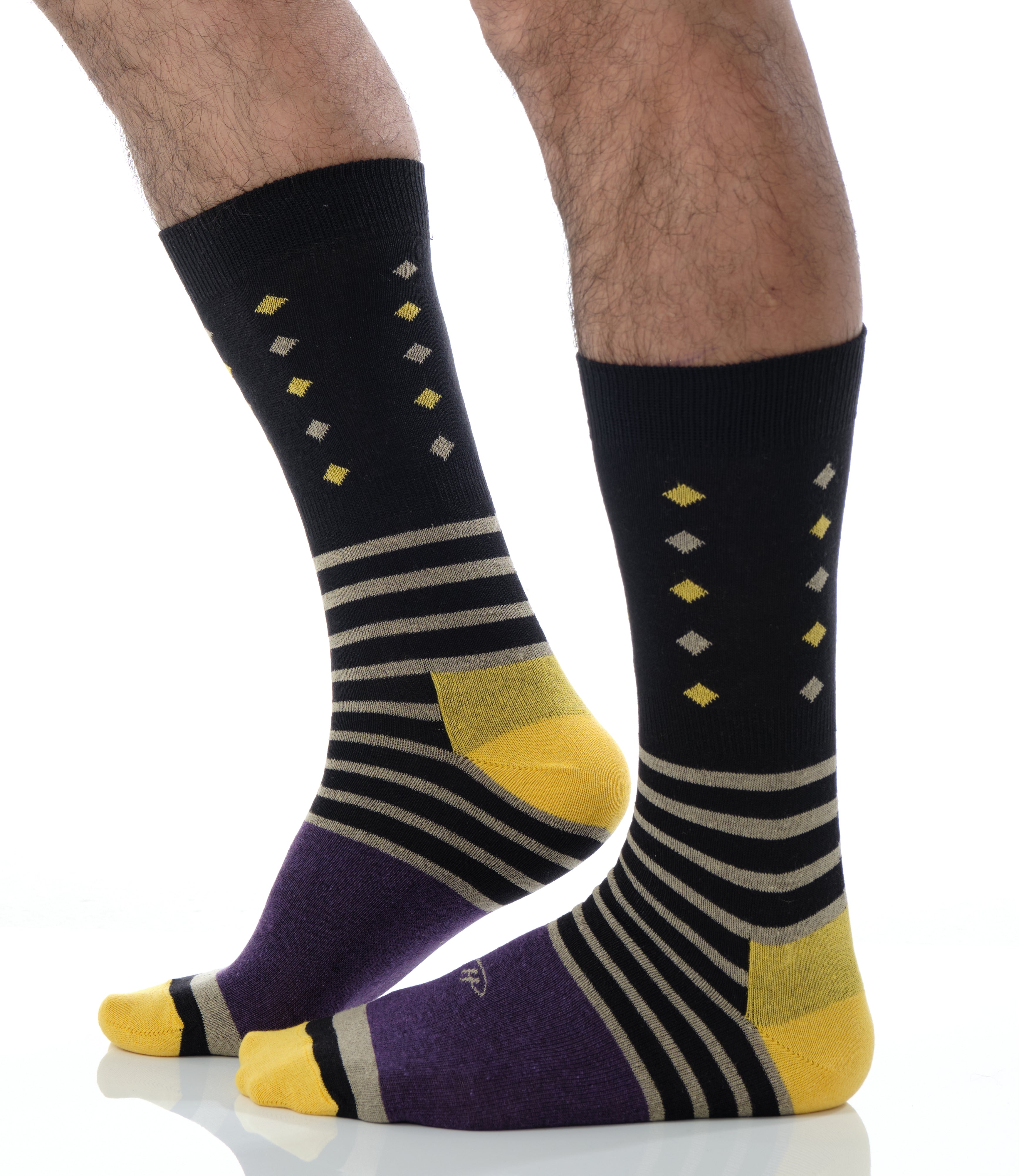 black mid calf dress socks with beige stripes and yellow and beige prints