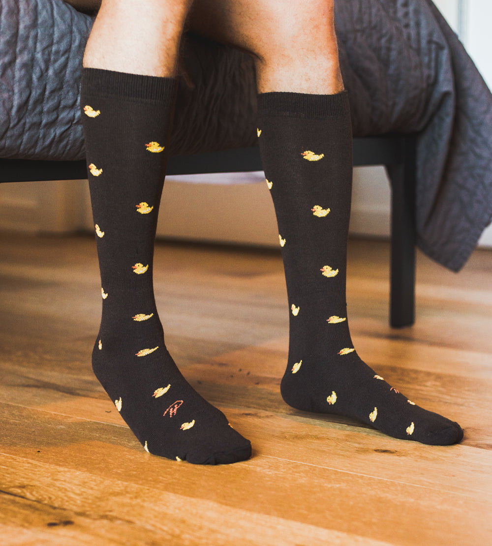 black over the calf dress socks with yellow duck prints