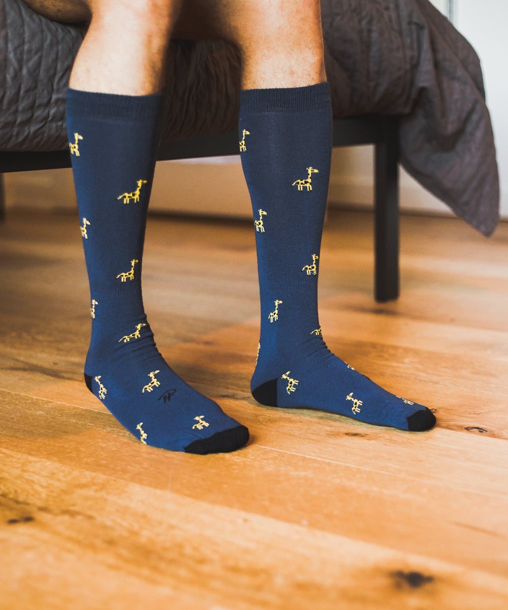 blue over the calf dress socks with giraffe print and black toe and heel