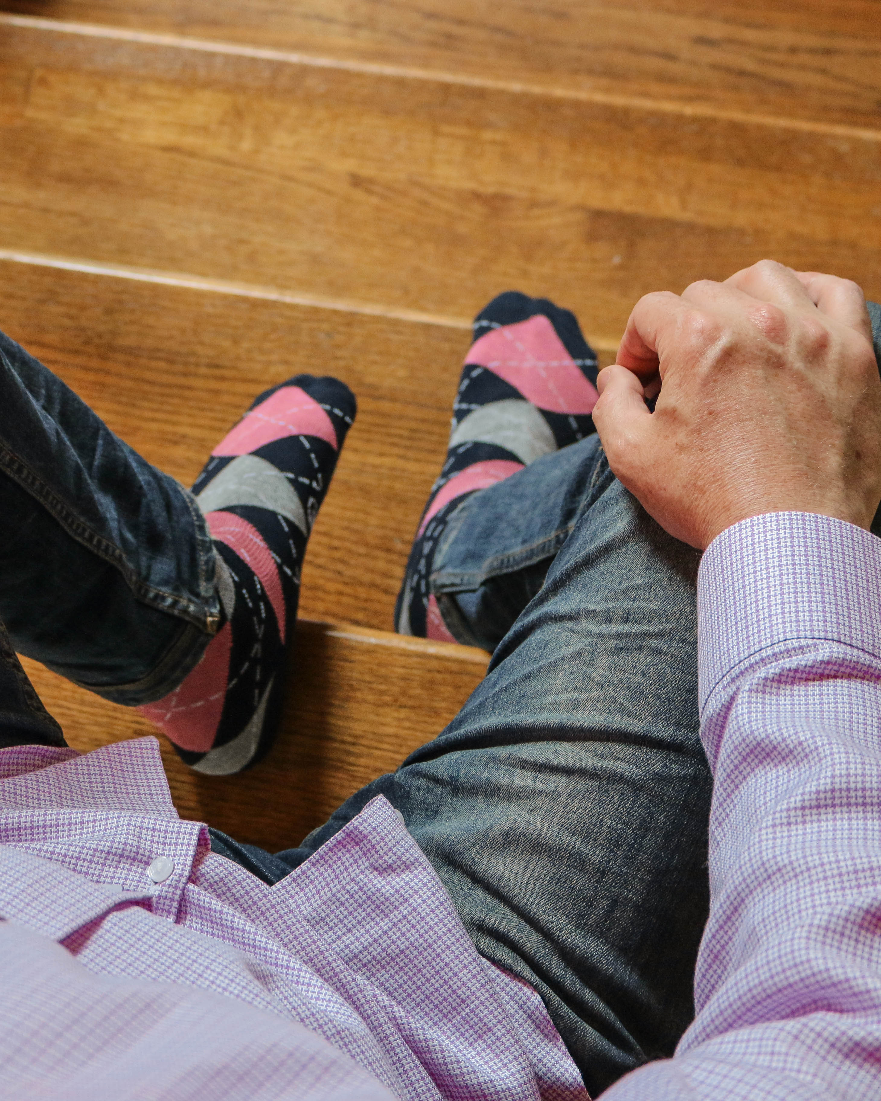 navy blue grey and pink argyle over the calf dress socks, jeans, purple plaid shirt