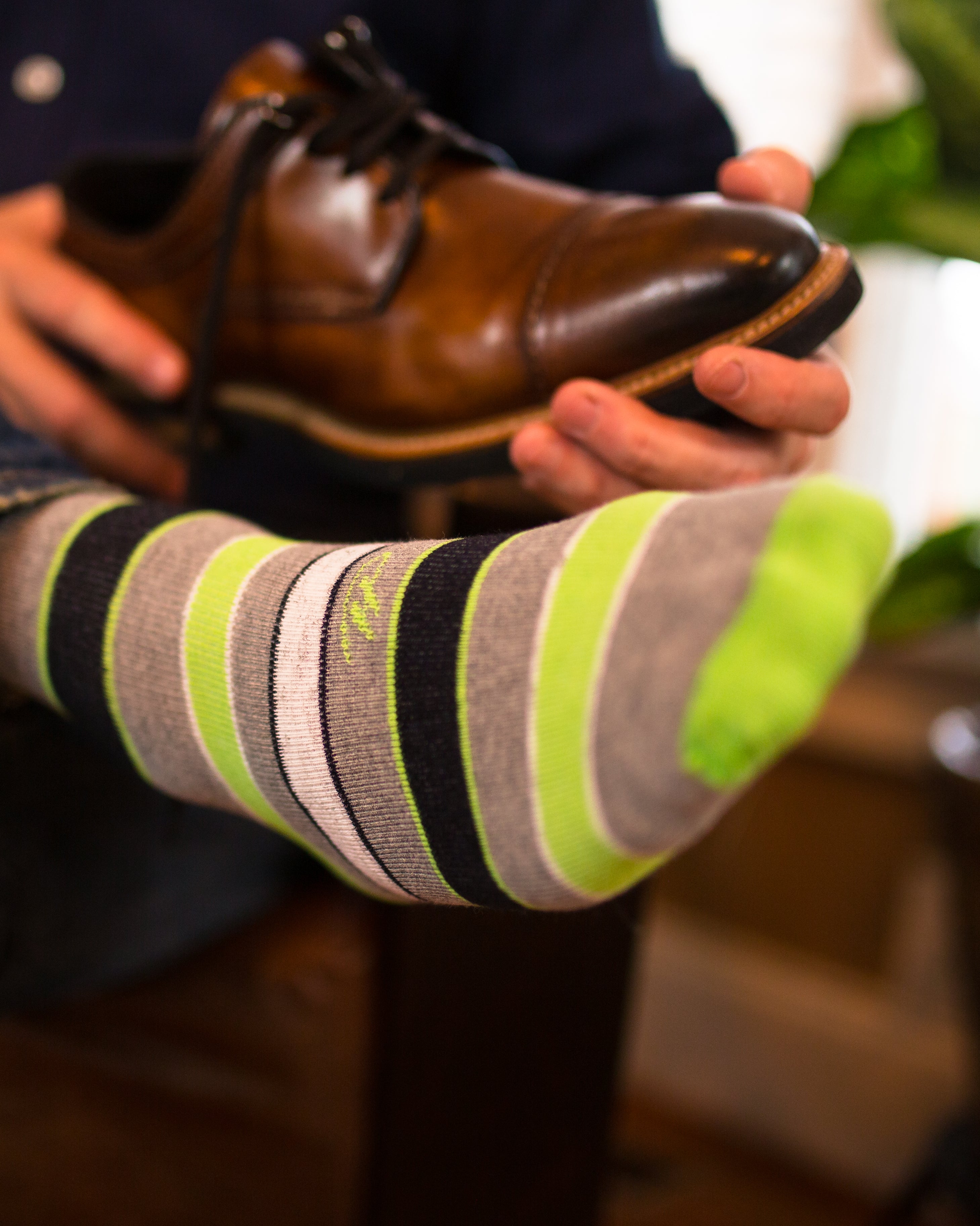 light grey over the calf dress socks with black light green and white stripes, brown dress shoe