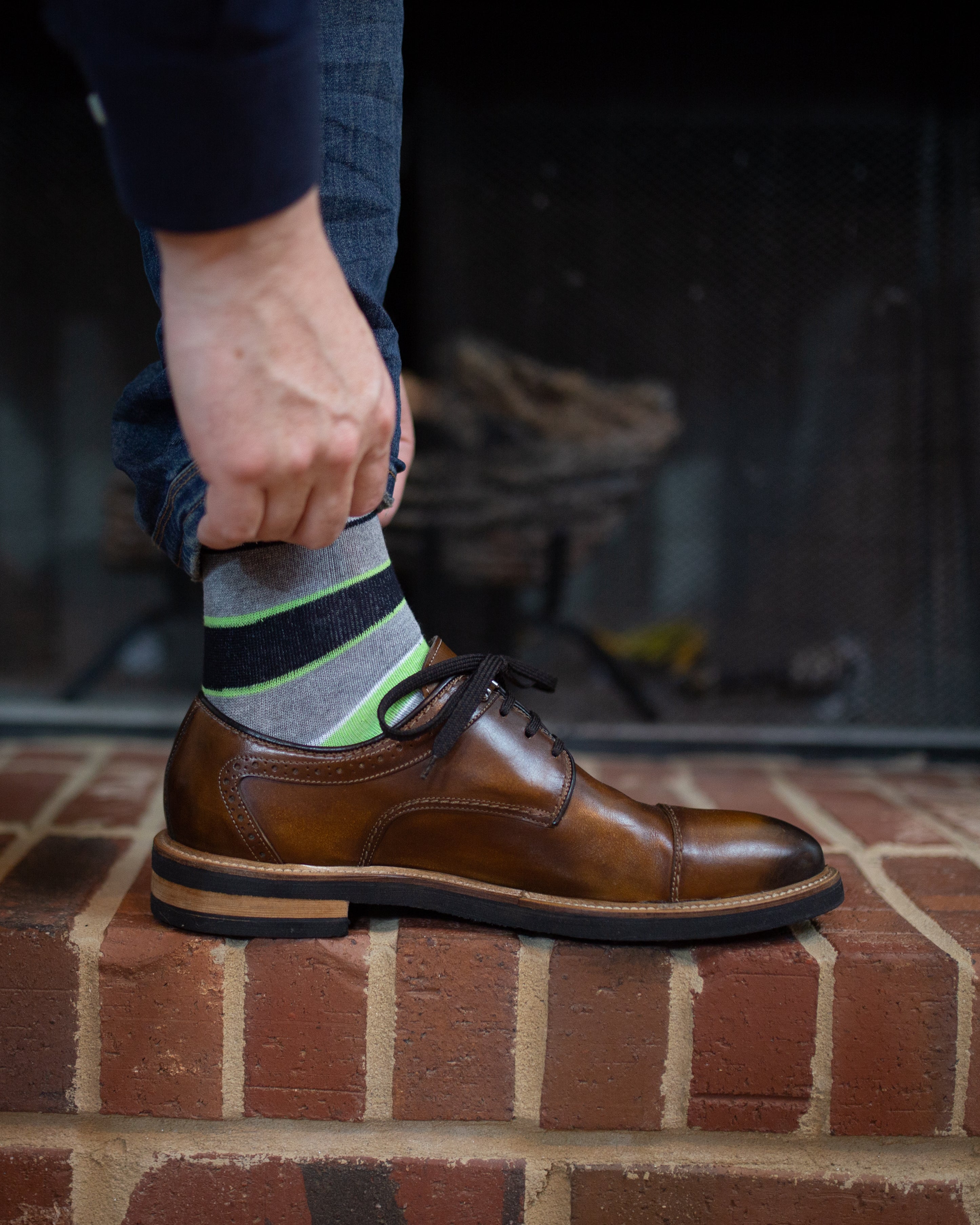 light grey over the calf dress socks with light green and black stripes, brown dress shoes, blue jeans