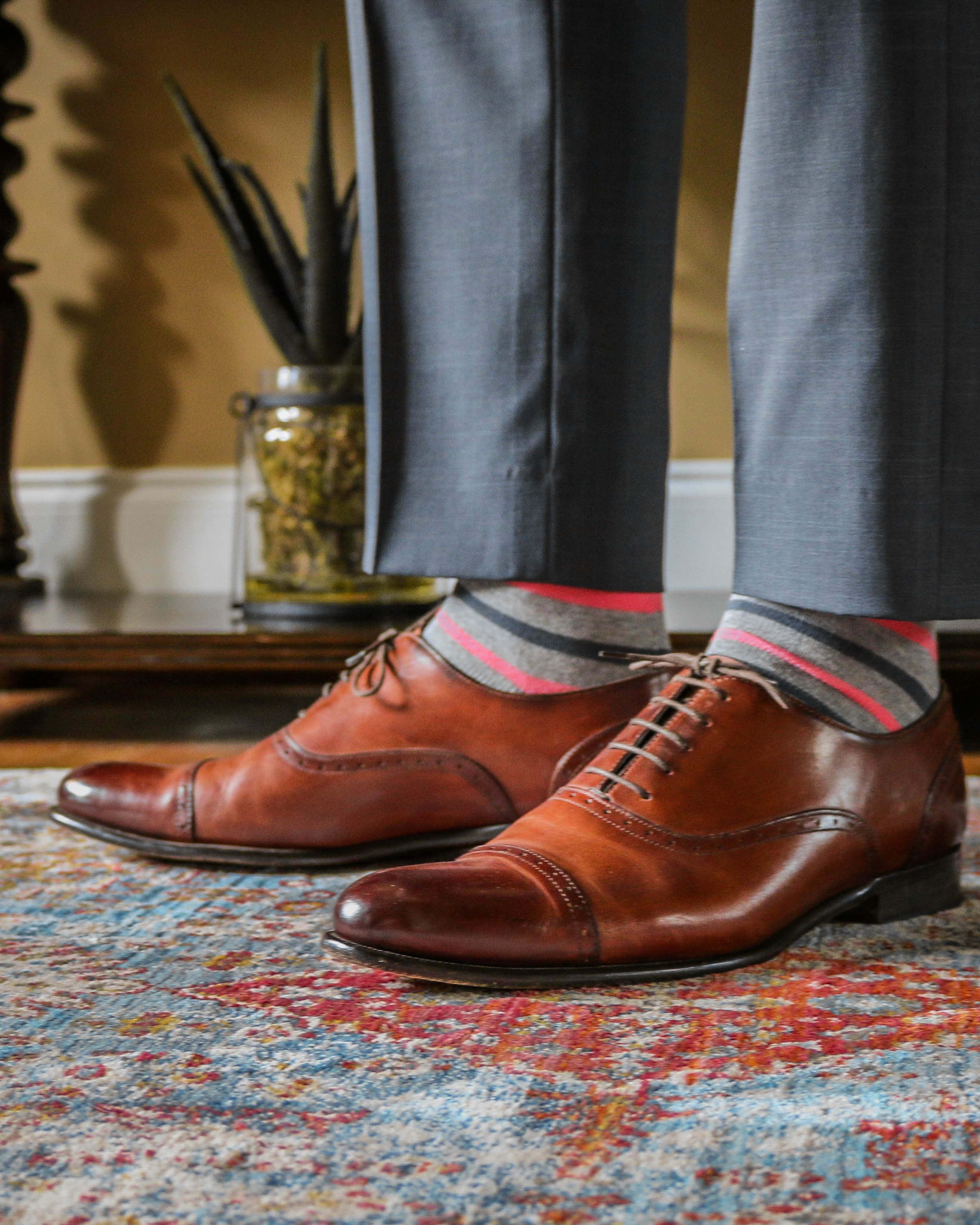 light grey over the calf dress socks with pink and grey stripes, brown dress shoes, grey dress pants