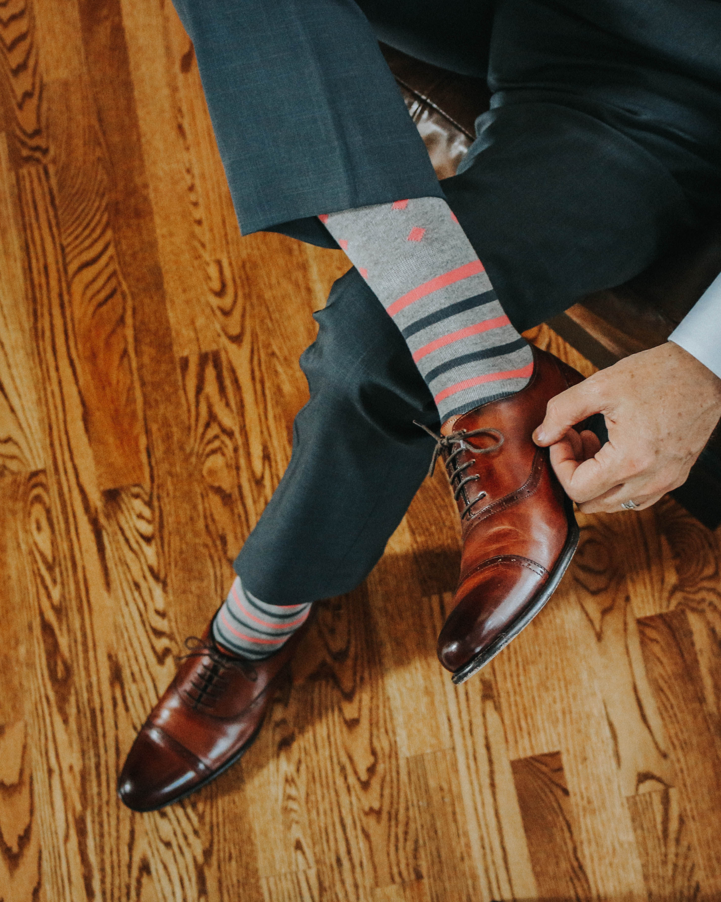 light grey over the calf dress socks with pink and grey stripes and pink diamond prints, brown dress shoes, grey dress pants