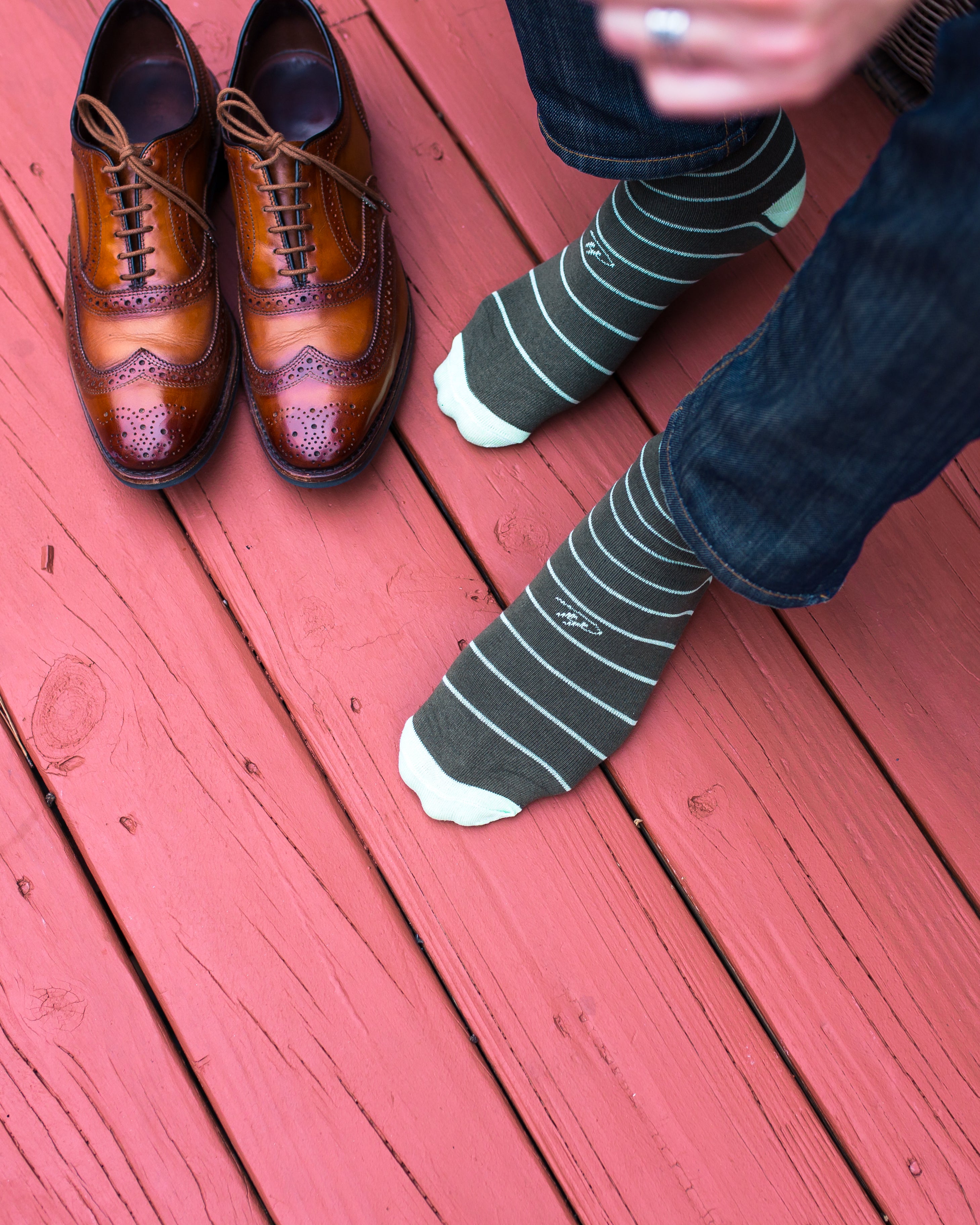 grey over the calf dress socks with light blue stripes, brown dress shoes, blue jeans