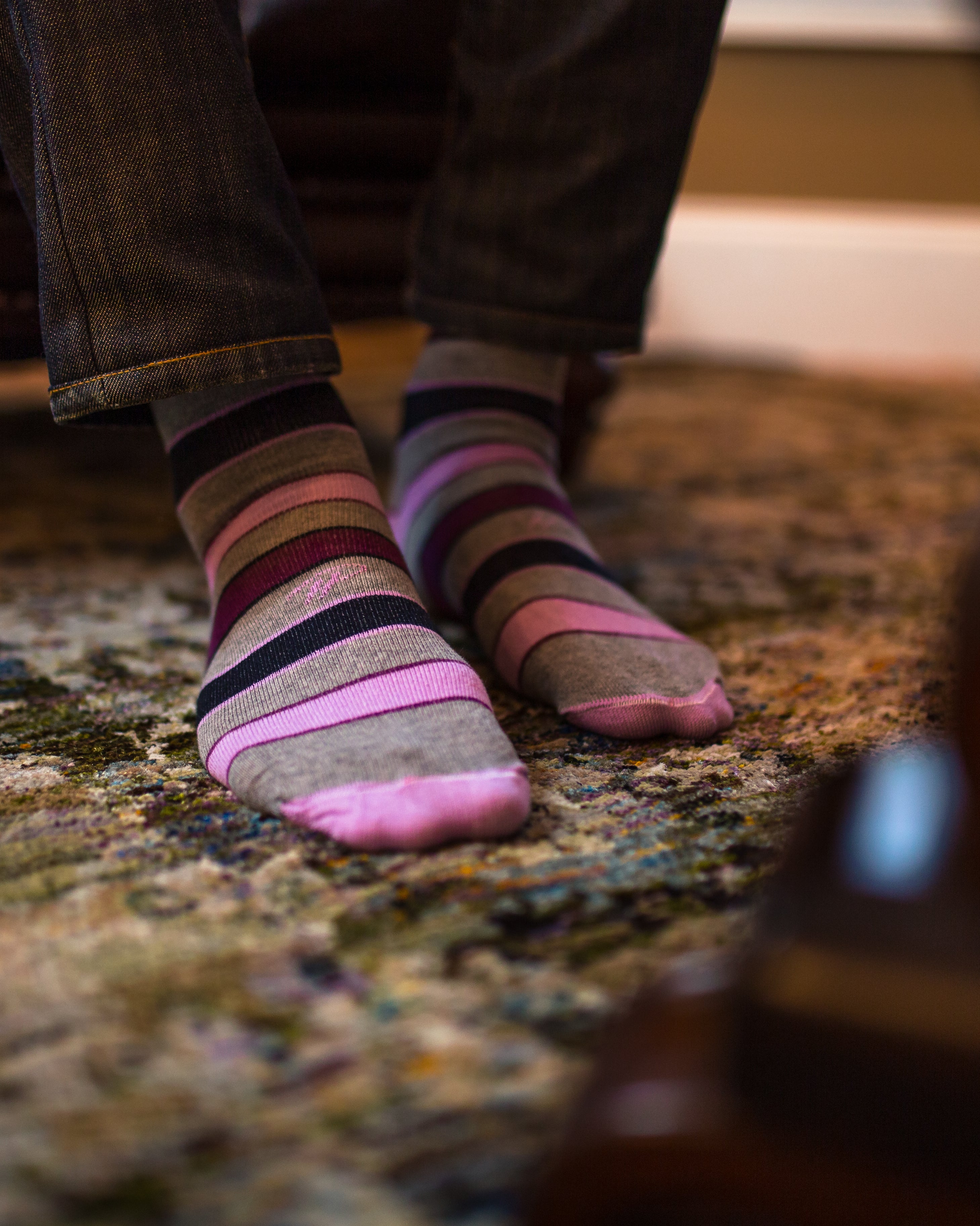 light grey over the calf dress socks with pink burgundy and black stripes, jeans