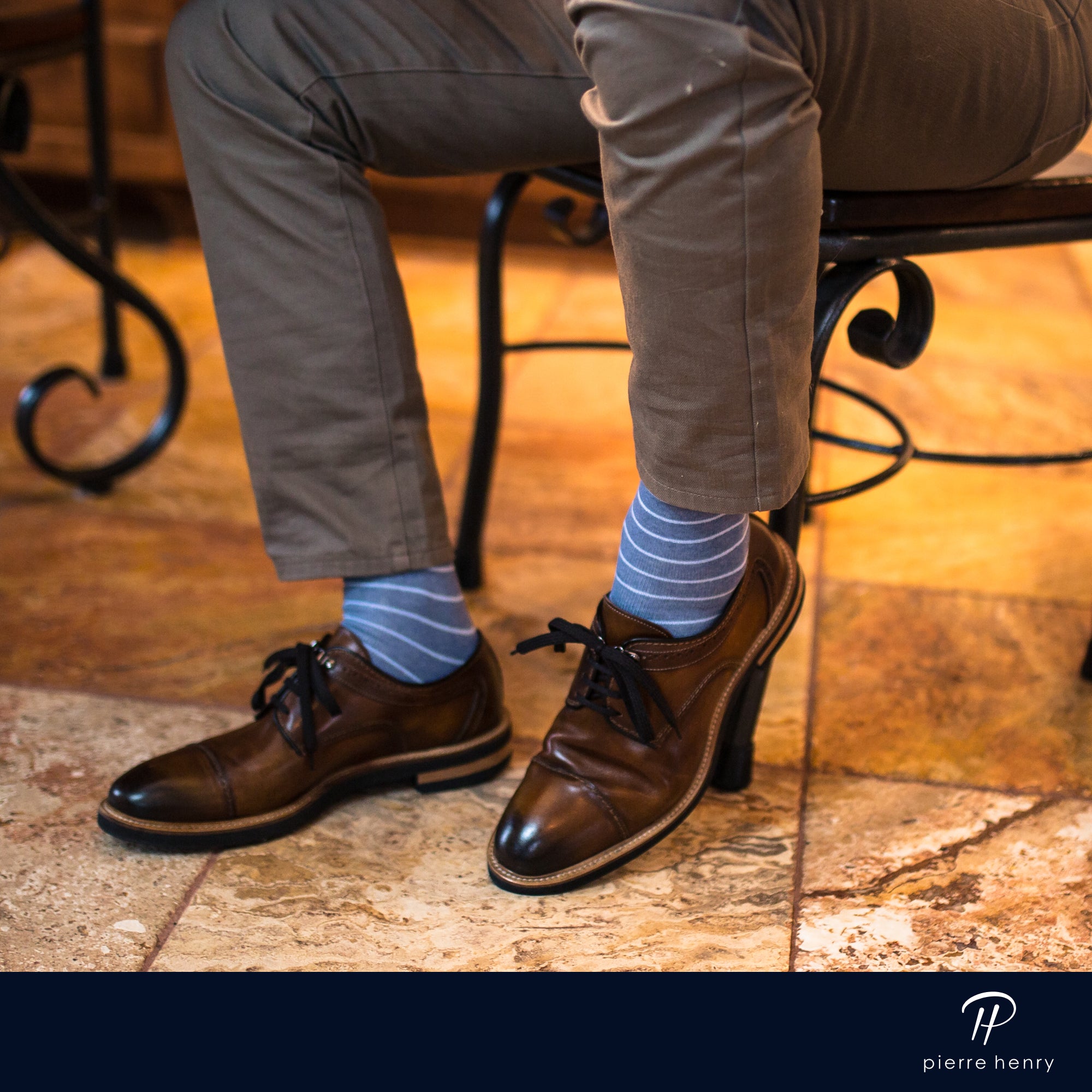 blue over the calf dress socks with light grey stripes, brown dress shoes with black laces, beige pants