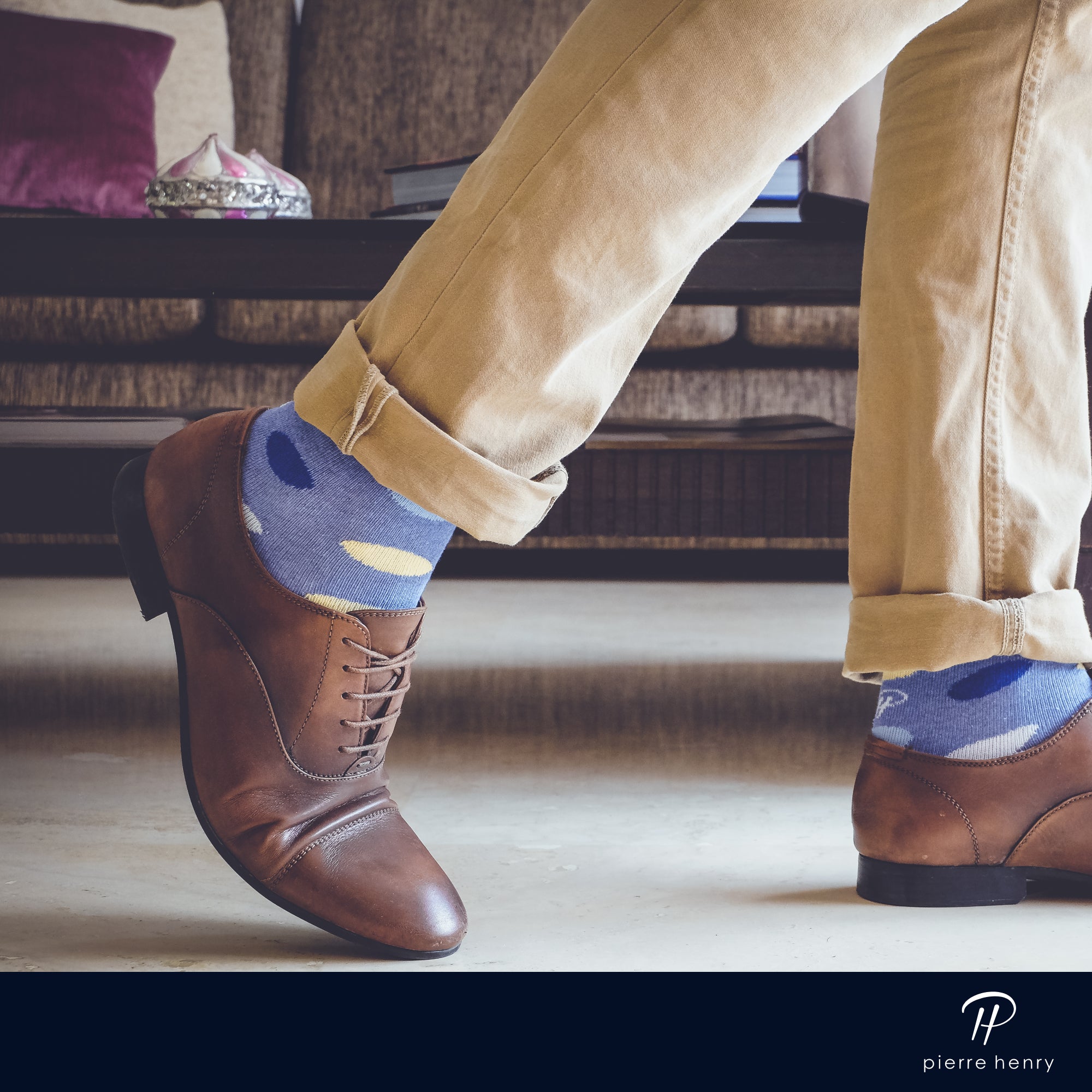 blue over the calf socks with yellow navy and light blue oval pattern, brown dress shoes, beige pants