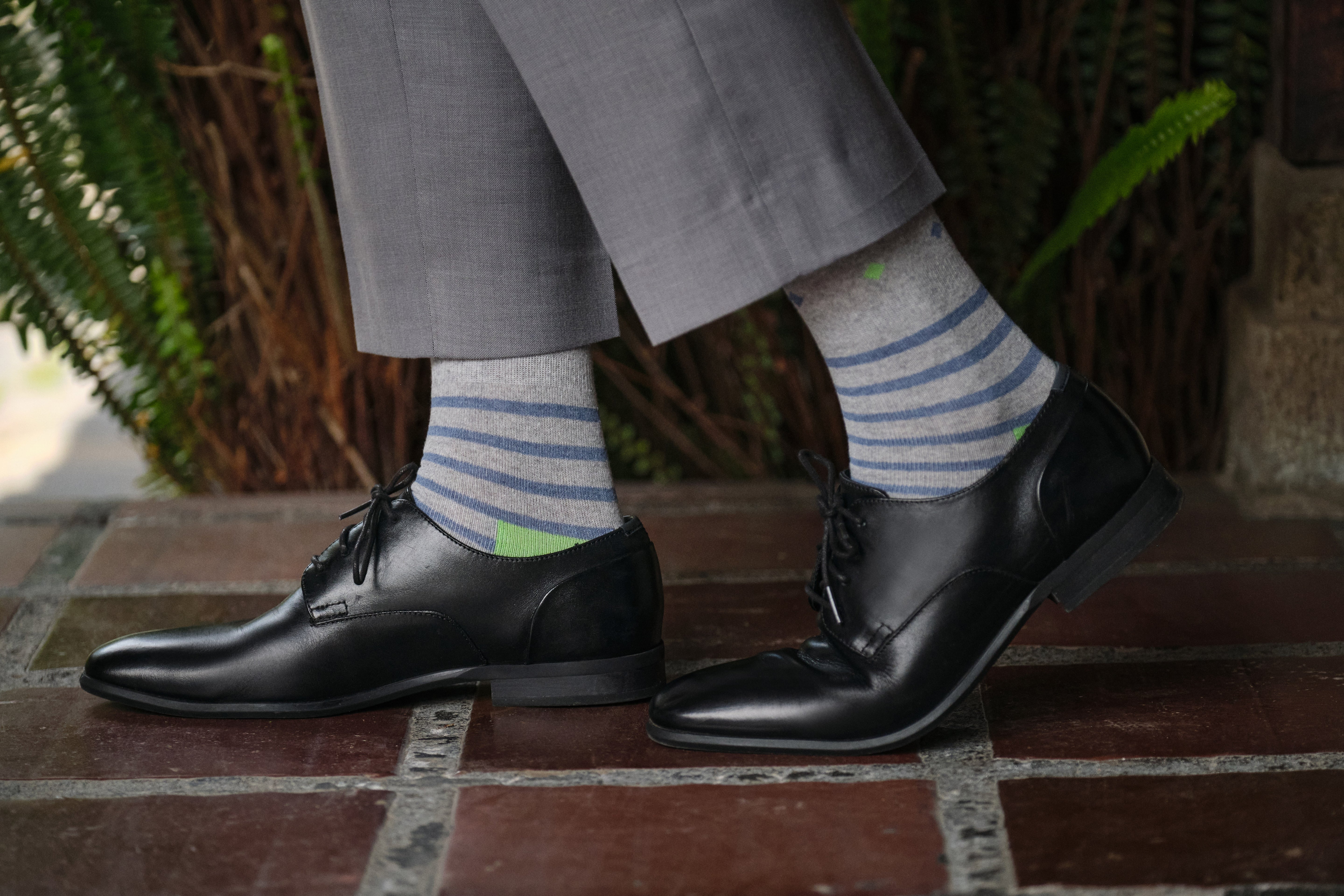 light grey mid calf dress socks with blue stripes and lime heel, lack dress shoes, grey dress pants