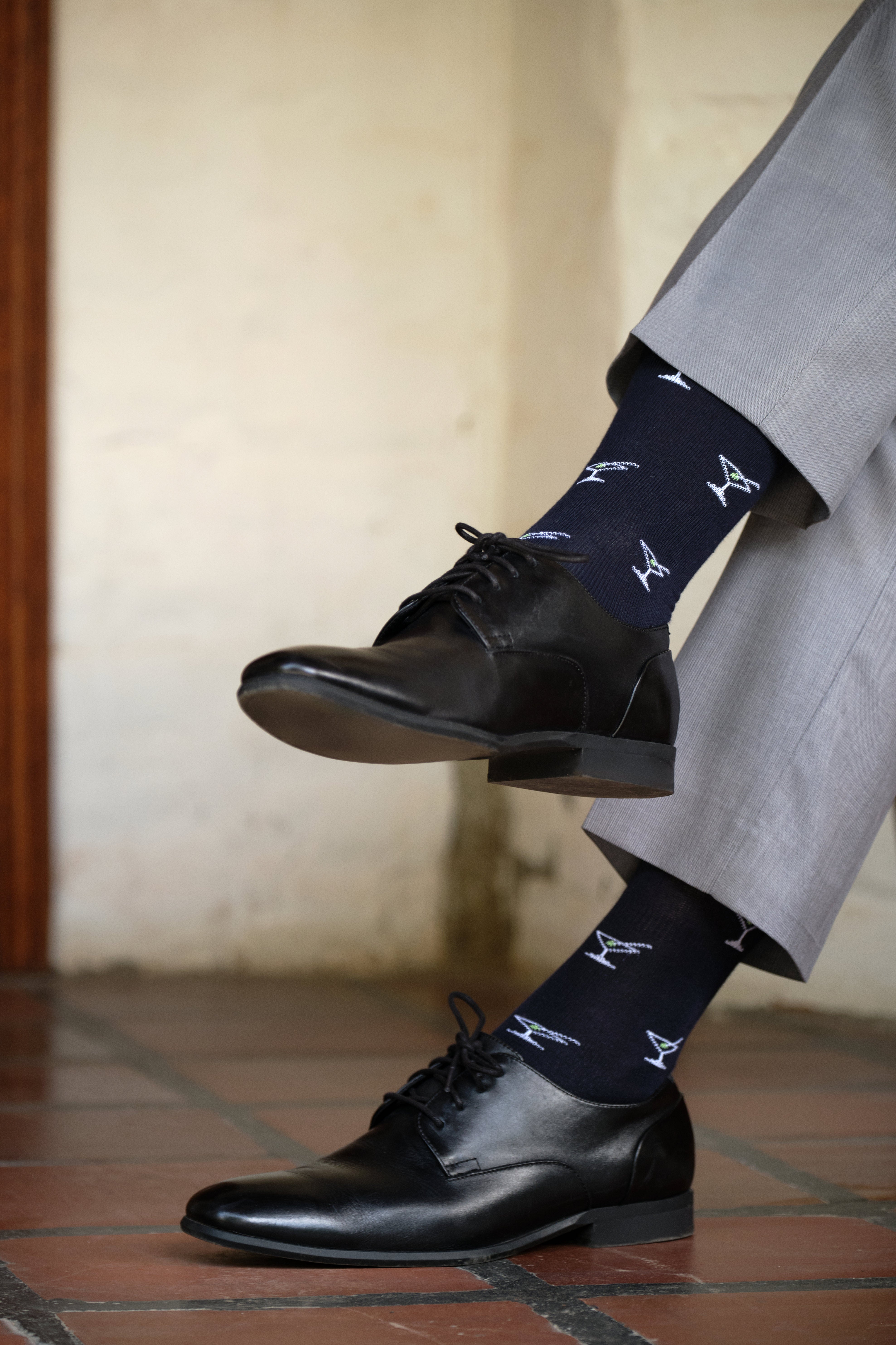 navy mid calf dress socks with cocktail prints, black dress shoes, grey dress pants